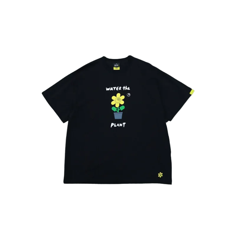 Black t-shirt with a flower graphic and text on a white background