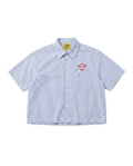 A short-sleeve button-up shirt with vertical blue and white stripes, featuring a red embroidered 'WATER THE PLANT TOKYO' house logo on the left chest pocket. The shirt is laid flat against a clean white background.