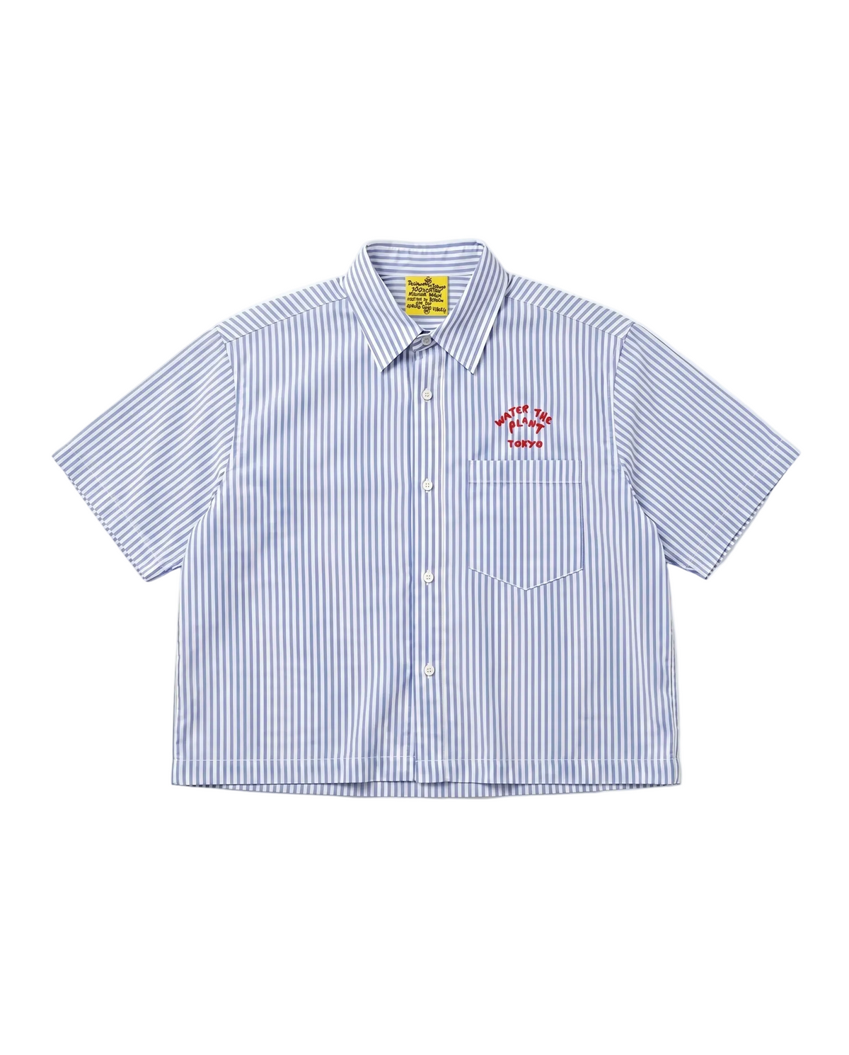 A short-sleeve button-up shirt with vertical blue and white stripes, featuring a red embroidered 'WATER THE PLANT TOKYO' house logo on the left chest pocket. The shirt is laid flat against a clean white background.