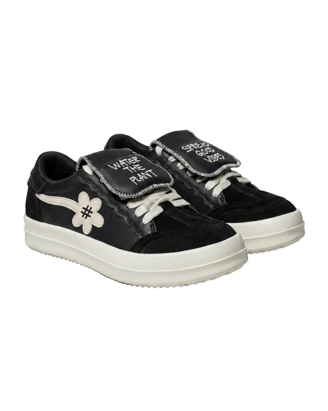 Black sneakers with white 'WATER THE PLANT' on the right and 'SPREAD GOOD VIBES' on the left text and a flower design on a white background