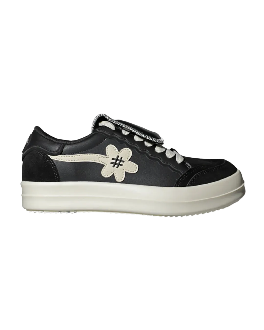 Black sneaker with a white flower design on a white background