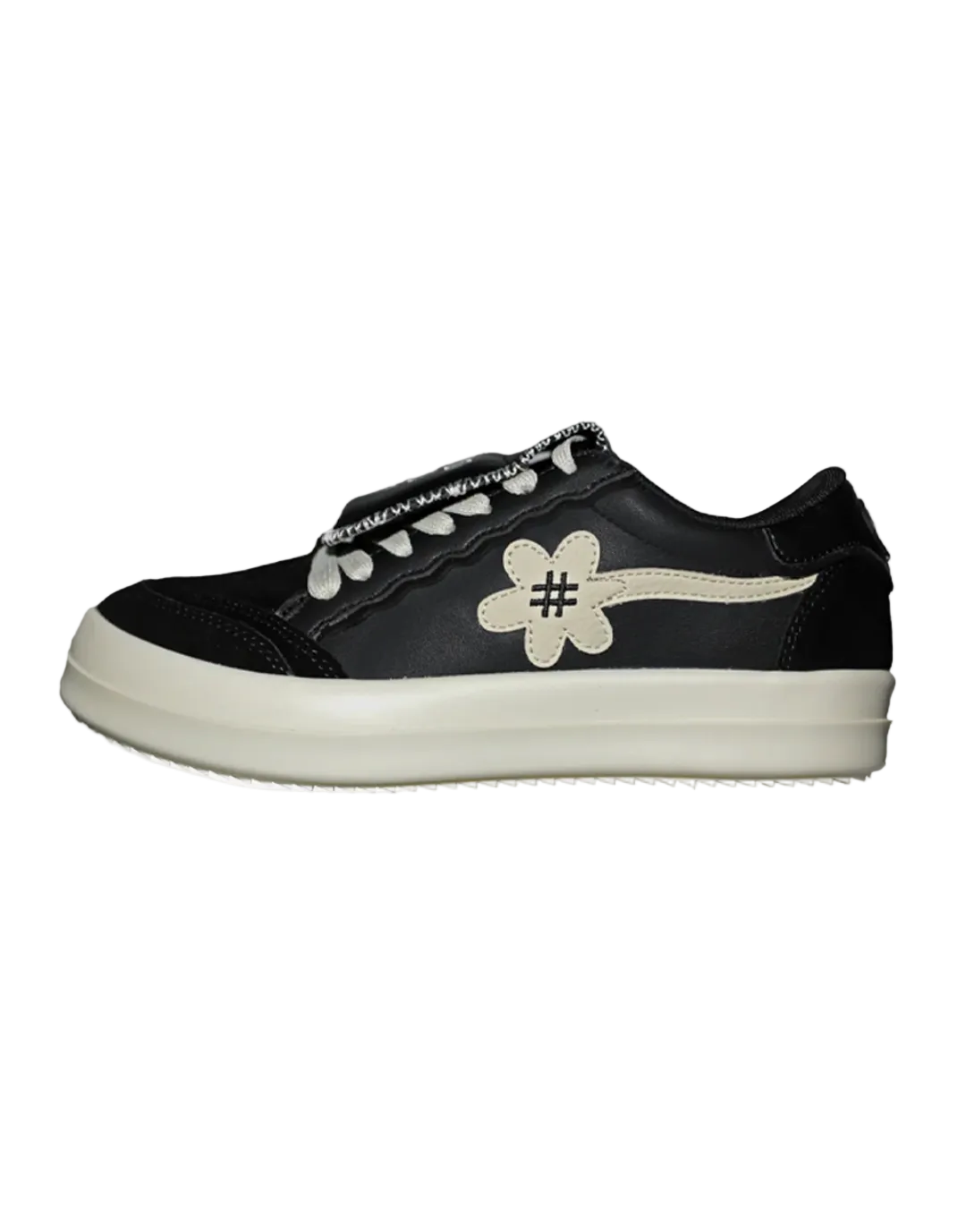 Black sneaker with white flower design and hashtag symbol on a white background