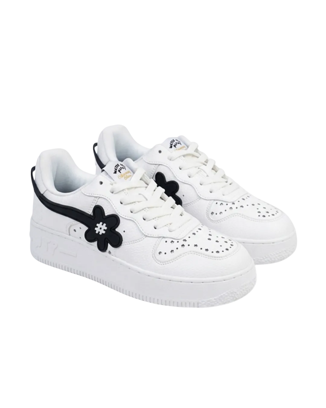 White sneakers with black floral design on a white background