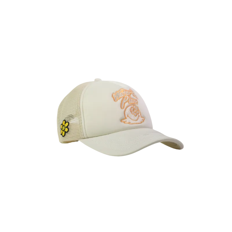 A light beige trucker hat with a curved brim, featuring an orange embroidered 'Water The Plant' logo on the front and a small yellow and black flower patch on the side mesh.