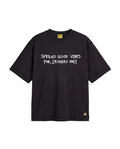 A black short-sleeve t-shirt with white text reading 'SPREAD GOOD VIBES FOR 24 HOURS ONLY' across the chest, featuring a WATER THE PLANT yellow flower logo near the bottom right hem and a yellow brand label inside the collar, shown on a plain white background.