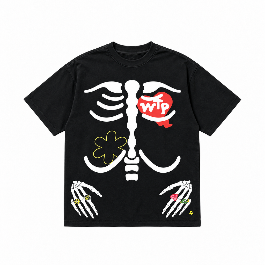A black short-sleeve t-shirt with a white skeleton rib cage graphic, featuring a red heart on the chest with 'wtp' in white text, a yellow flower on the left side, and skeletal hands with colorful rings at the bottom.