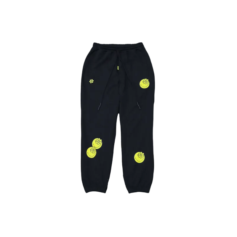 Black sweatpants with yellow WATER THE PLANT SMILEY® circular designs on a white background