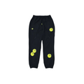 Black sweatpants with yellow WATER THE PLANT SMILEY® circular designs on a white background