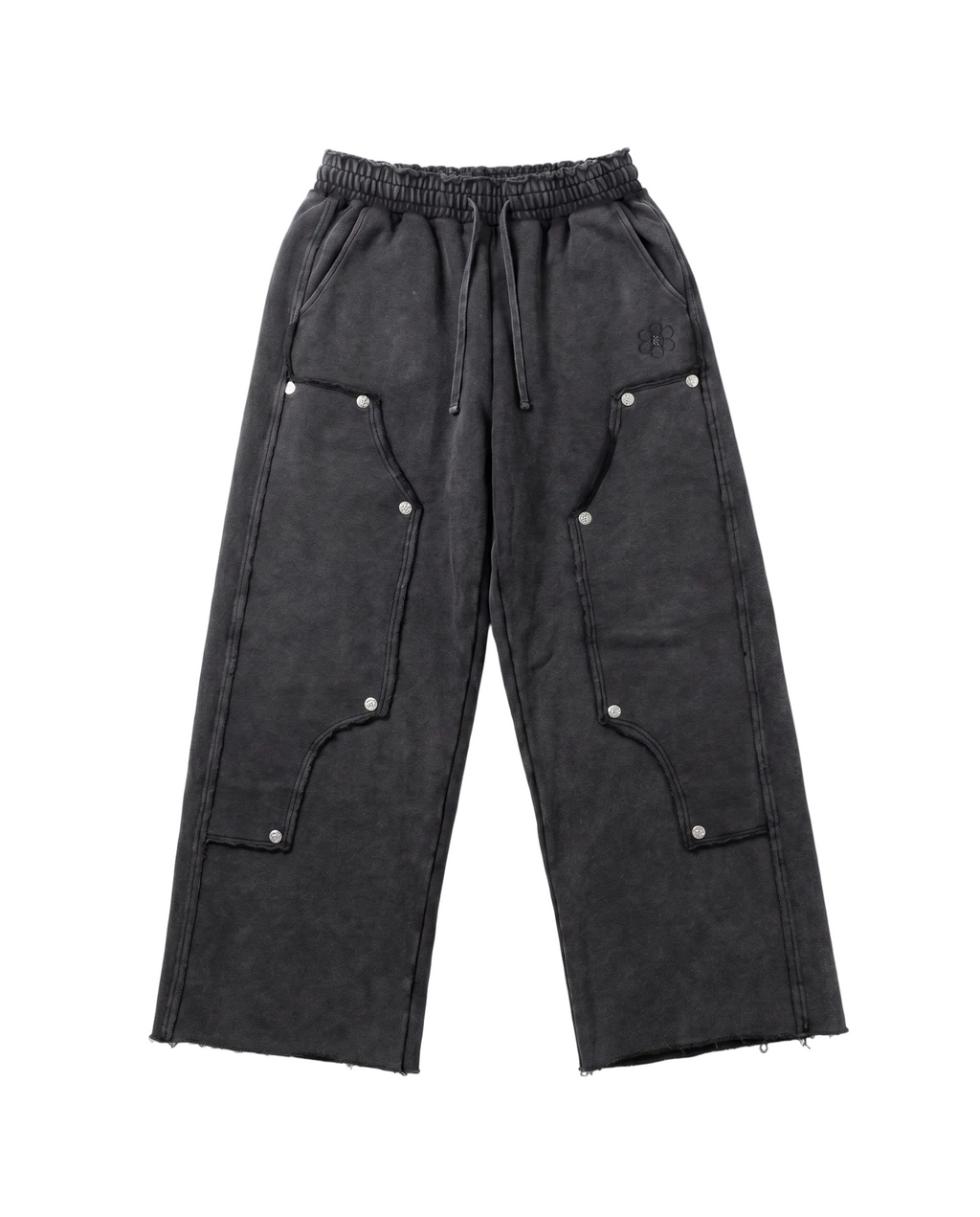Black pants with button details on a white background