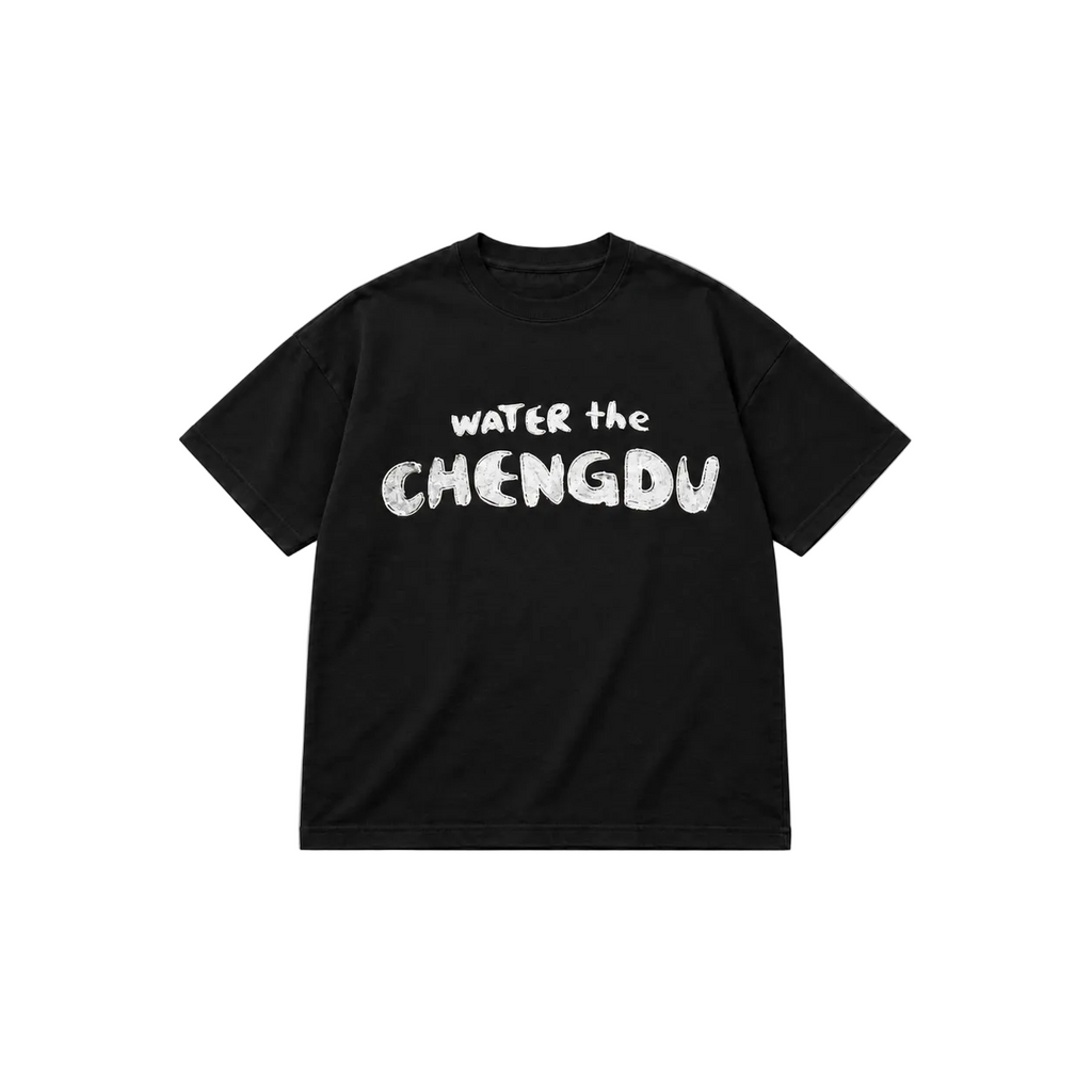 A black short-sleeve crewneck t-shirt with the phrase 'WATER the CHENGDU' printed in a distressed white font across the chest, displayed flat against a solid white background.