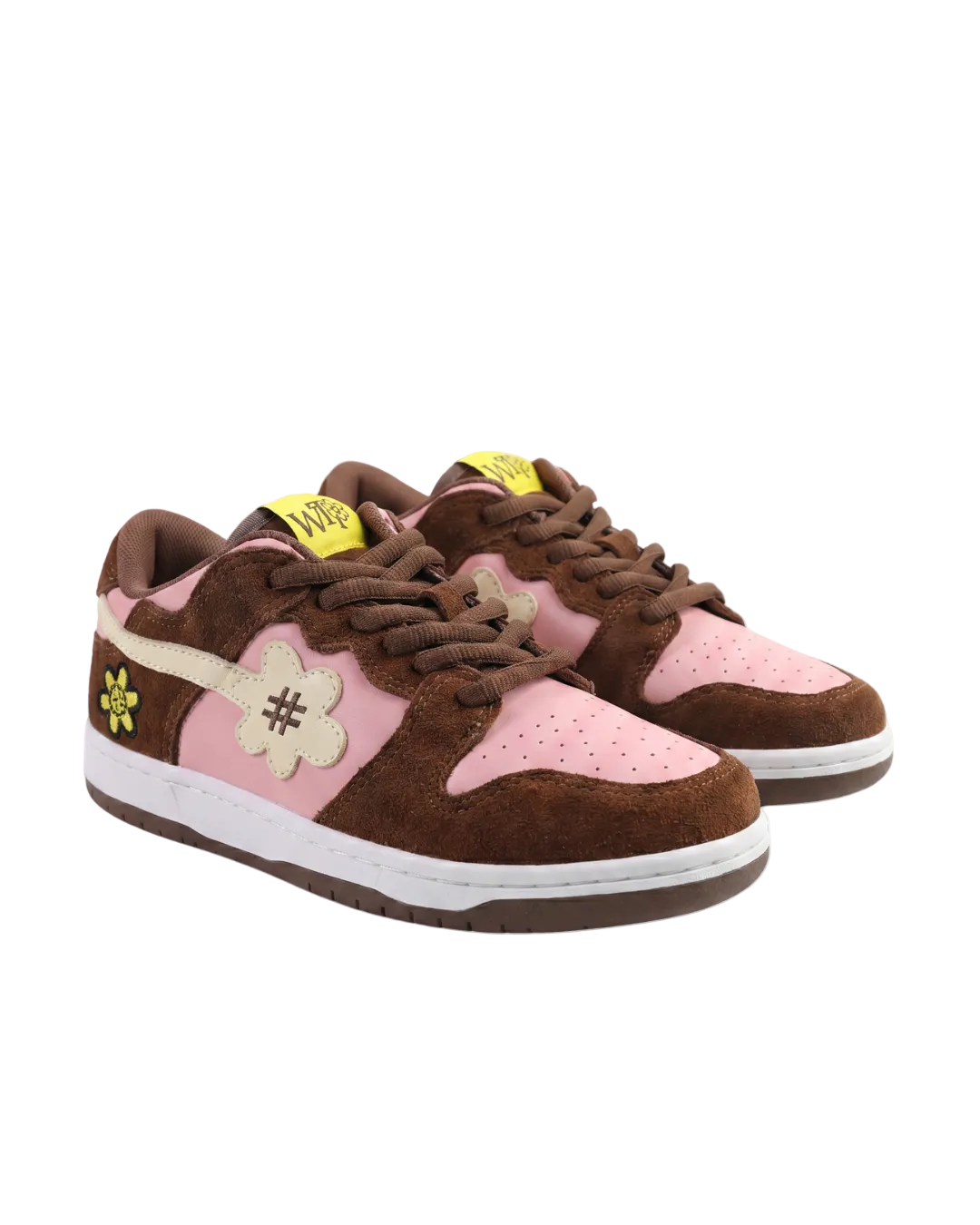 Pair of brown and pink sneakers with decorative elements on a white background