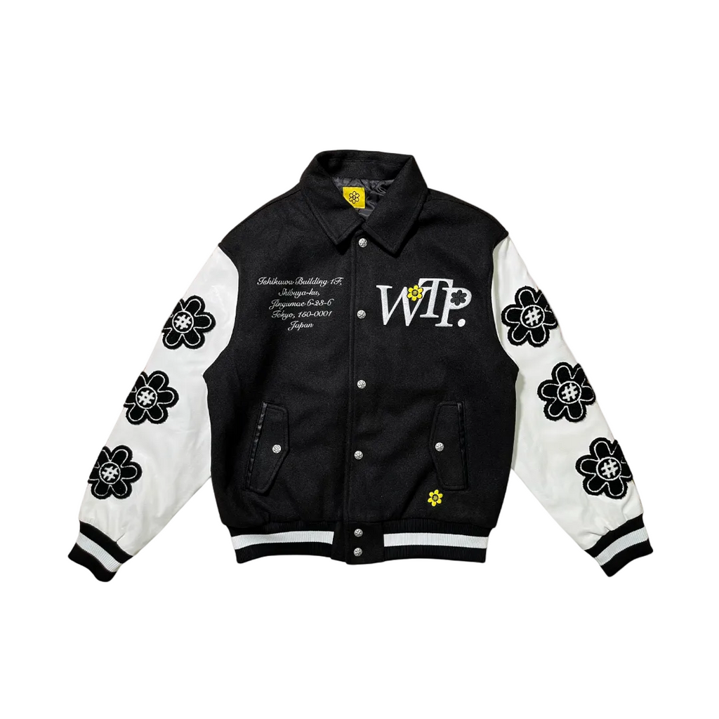 Black and white varsity jacket with floral designs and text on a white background